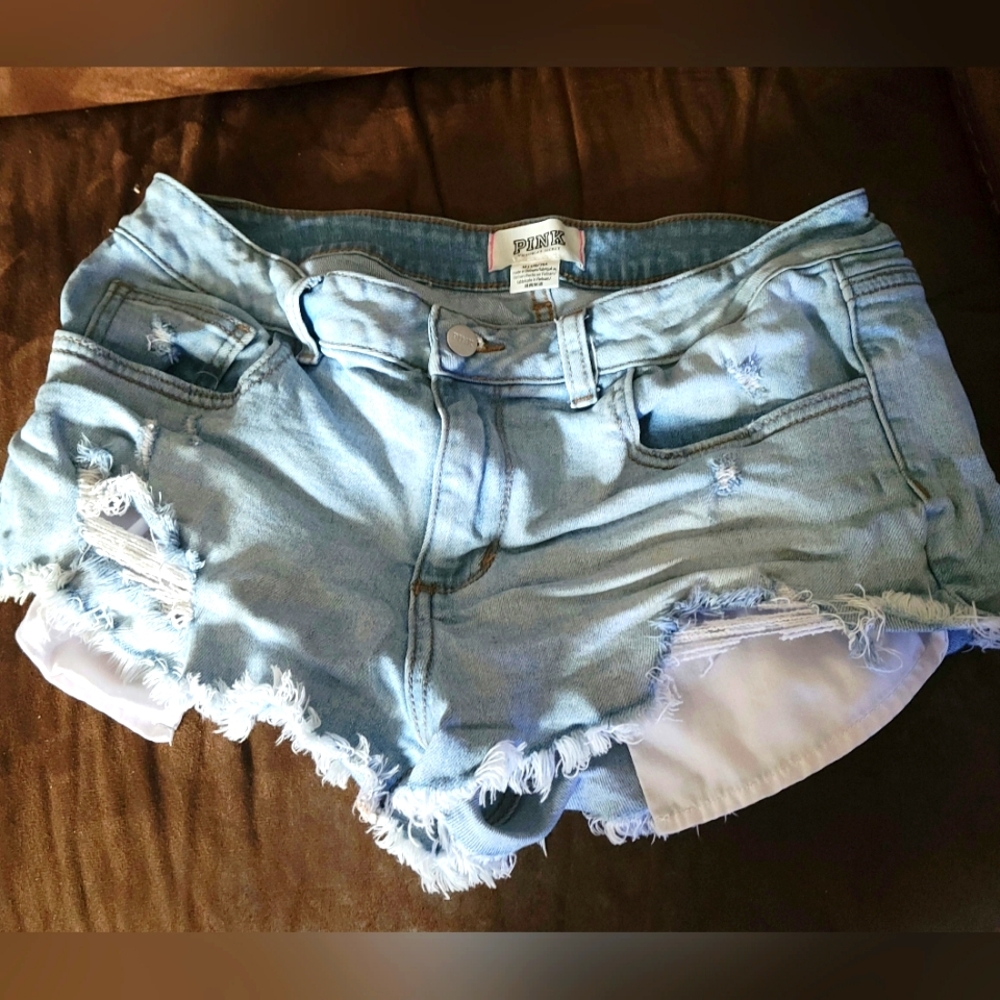 Pink Daisy Duke Light denim distressed shorts